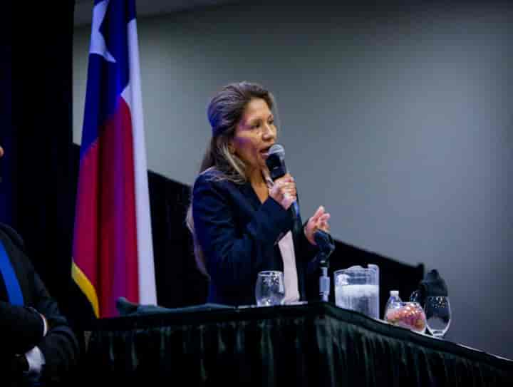 Speaker presenting at a Minerva event in El Paso — client project